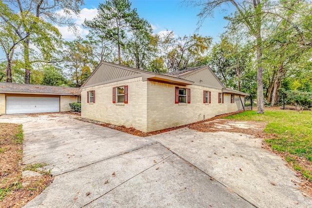 view of property exterior with a garage