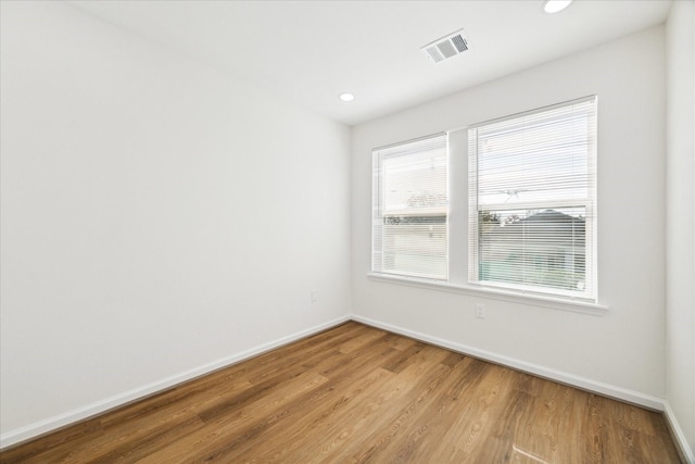 empty room with wood-type flooring