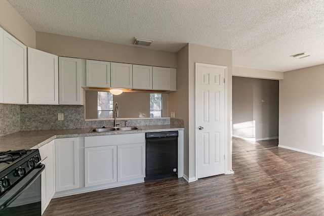 kitchen featuring dark wood-type flooring, white cabinetry, sink, and black appliances