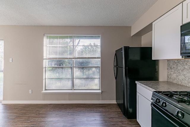 kitchen featuring white cabinetry, dark wood-type flooring, and black appliances