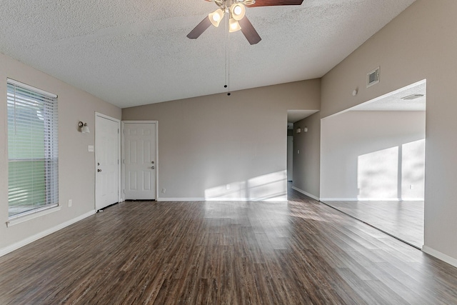 unfurnished living room featuring a textured ceiling, hardwood / wood-style flooring, and vaulted ceiling