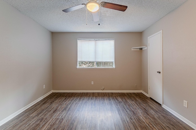 unfurnished room with a textured ceiling, dark hardwood / wood-style floors, and ceiling fan