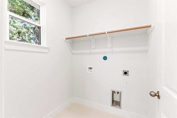 laundry area featuring hookup for an electric dryer and hookup for a washing machine