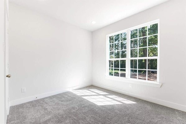 empty room with light colored carpet