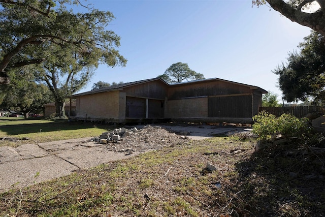 view of home's exterior with a lawn