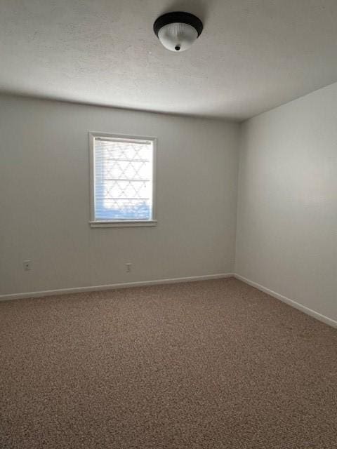 empty room featuring carpet floors