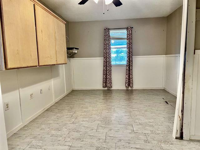 unfurnished room featuring ceiling fan