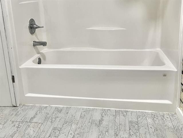 bathroom with shower / bathtub combination