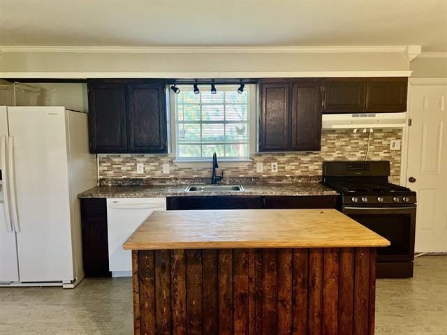 kitchen featuring a kitchen island, sink, crown molding, dark brown cabinets, and white appliances