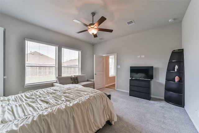 bedroom featuring light carpet and ceiling fan