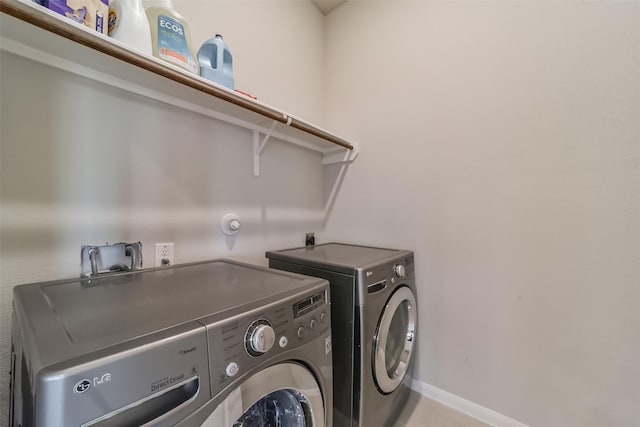 laundry room featuring separate washer and dryer