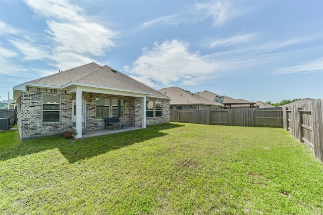 view of yard with a patio area and central AC unit