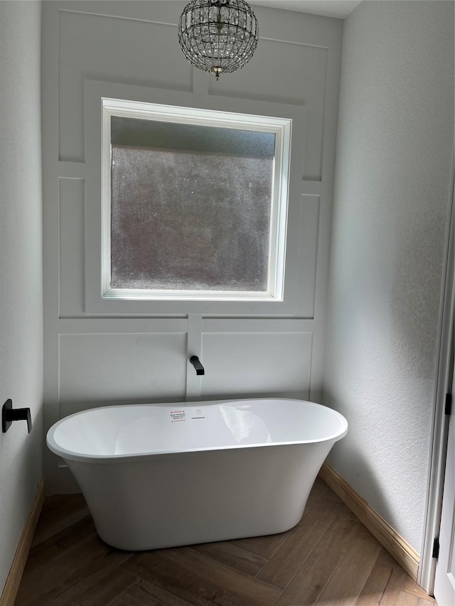 bathroom featuring hardwood / wood-style flooring and a bathtub