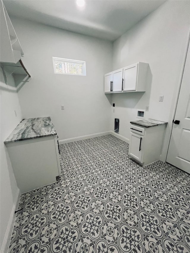 washroom with cabinets, light tile patterned flooring, electric dryer hookup, and hookup for a washing machine