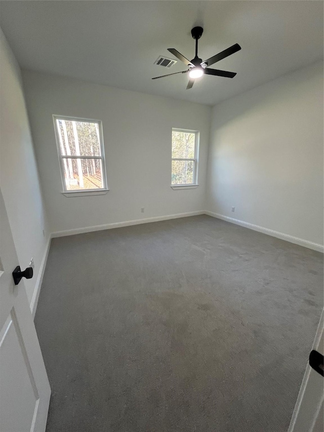 empty room with carpet flooring and ceiling fan