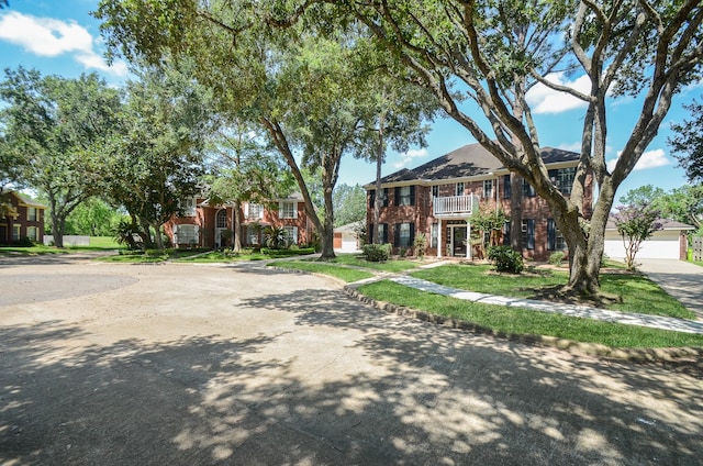 view of front of house featuring a balcony