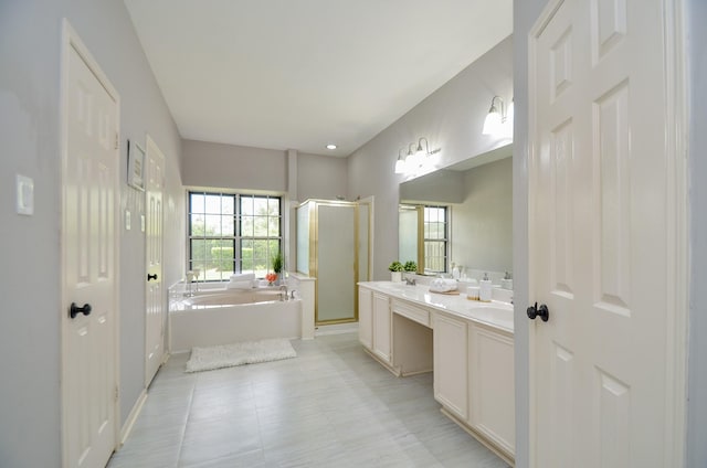 bathroom with tile patterned floors, vanity, and independent shower and bath