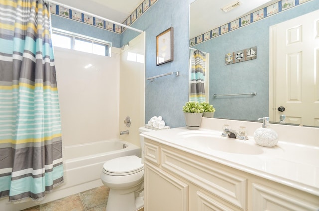 full bathroom featuring tile patterned flooring, vanity, toilet, and shower / bathtub combination with curtain