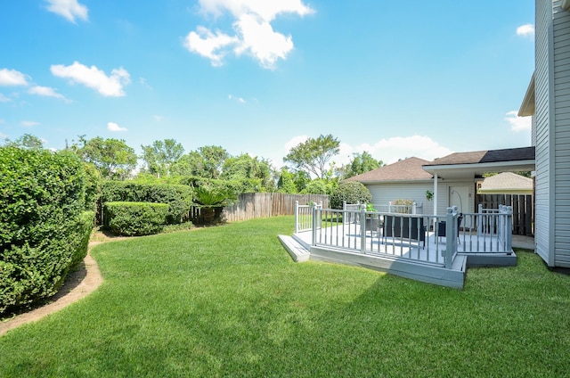 view of yard featuring a wooden deck