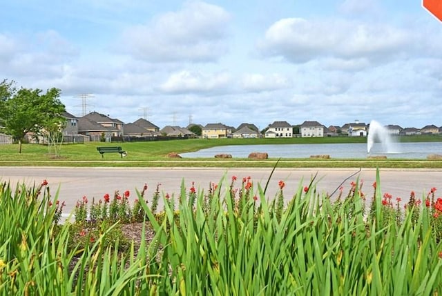 view of community with a water view