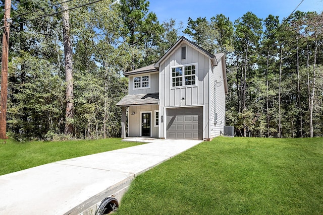 view of front of house with a front yard and a garage