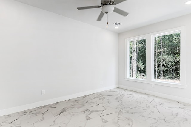 spare room with ceiling fan