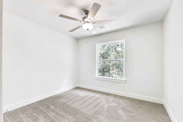 unfurnished room with carpet flooring and ceiling fan