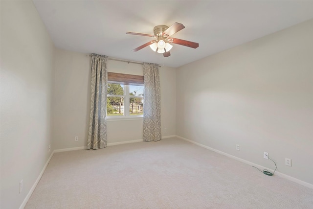 spare room with carpet flooring and ceiling fan