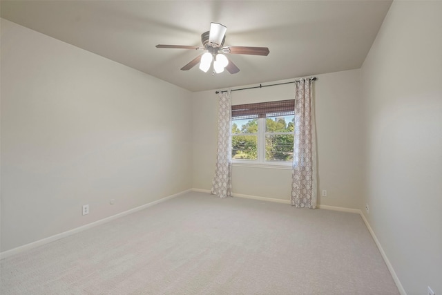 empty room featuring carpet floors and ceiling fan