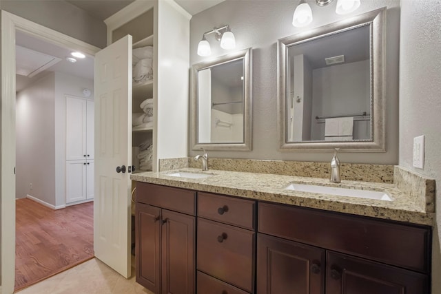 bathroom featuring wood-type flooring and vanity