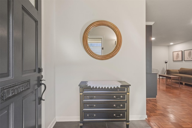 entryway with dark parquet floors