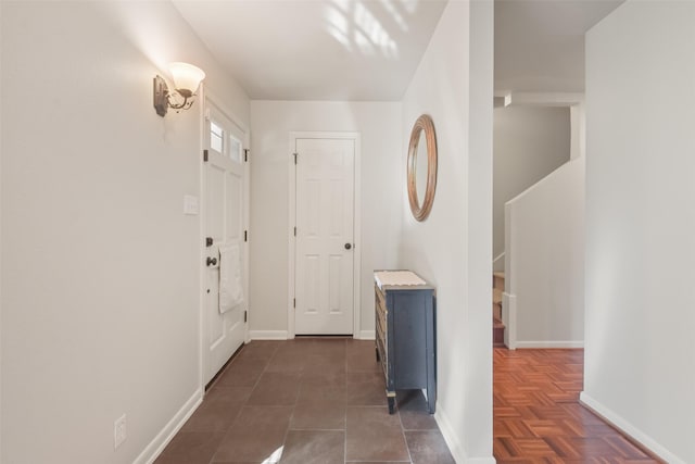 hallway with dark parquet flooring