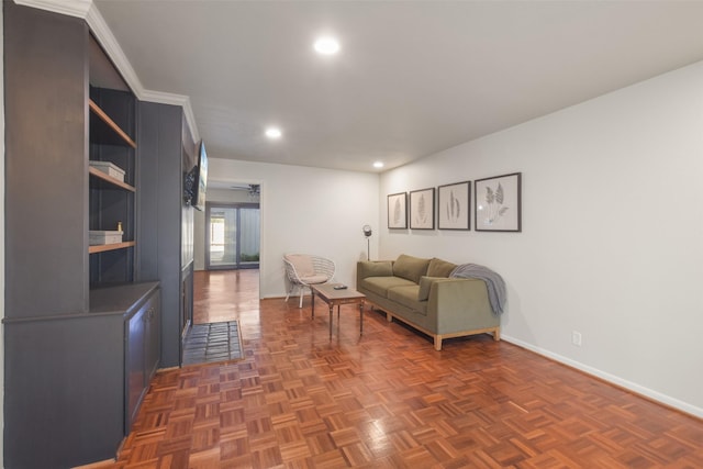 living room featuring dark parquet floors and crown molding