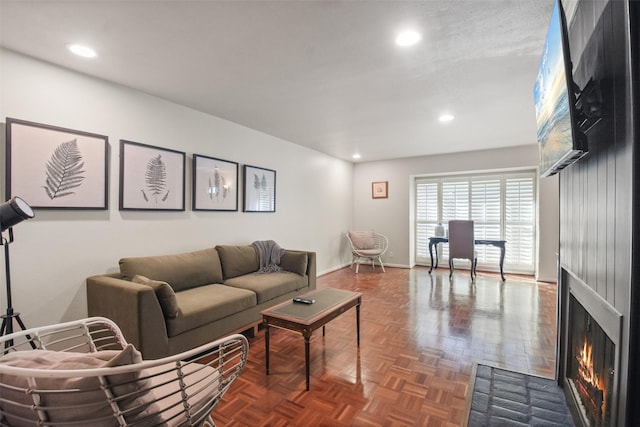 living room featuring dark parquet floors