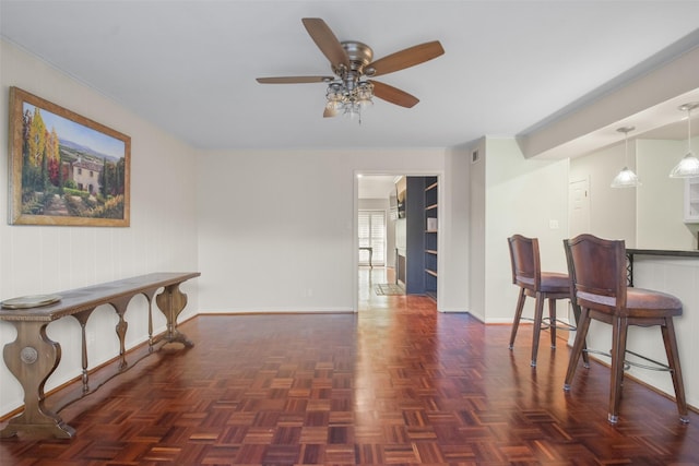 interior space featuring dark parquet floors and ceiling fan