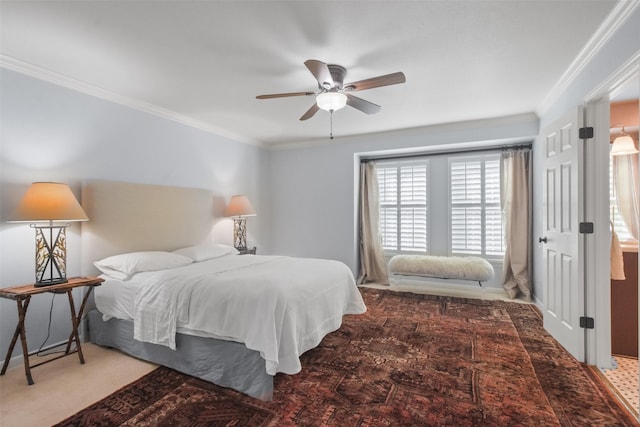 carpeted bedroom with ceiling fan and ornamental molding