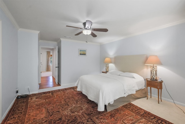 bedroom featuring ceiling fan and ornamental molding