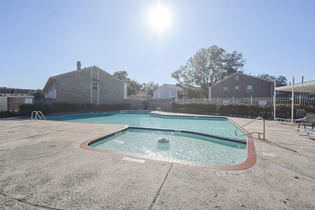 view of pool featuring a patio