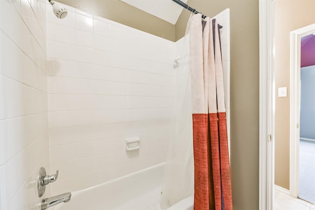 bathroom featuring shower / bathtub combination with curtain