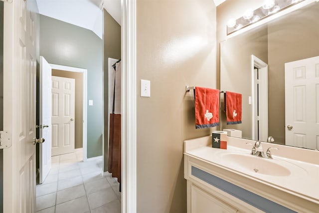 bathroom with tile patterned floors and vanity