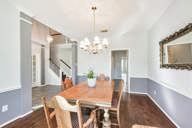 dining room featuring a notable chandelier and dark hardwood / wood-style flooring