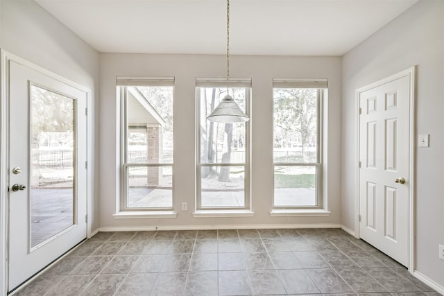 doorway to outside featuring light tile patterned floors