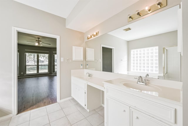 bathroom featuring a shower, ceiling fan, vanity, and hardwood / wood-style flooring