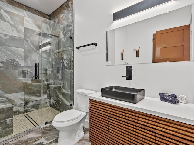 bathroom featuring walk in shower, vanity, and toilet