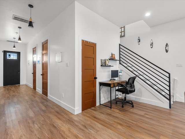 office area with light hardwood / wood-style flooring