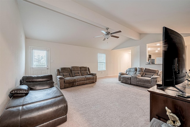 carpeted living room featuring vaulted ceiling with beams, ceiling fan, and a healthy amount of sunlight