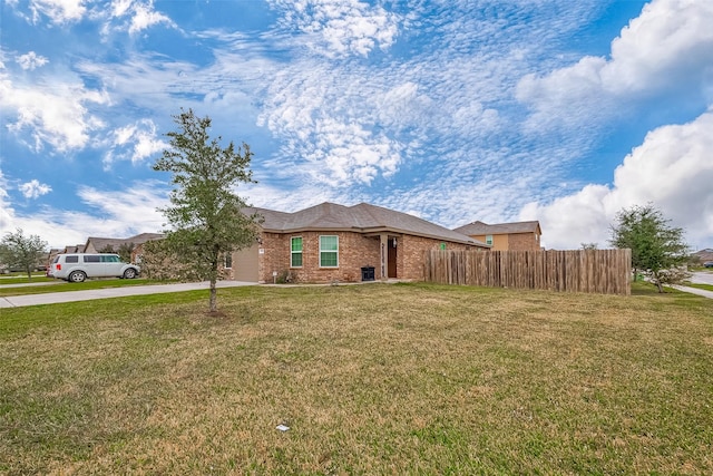 single story home featuring a front lawn