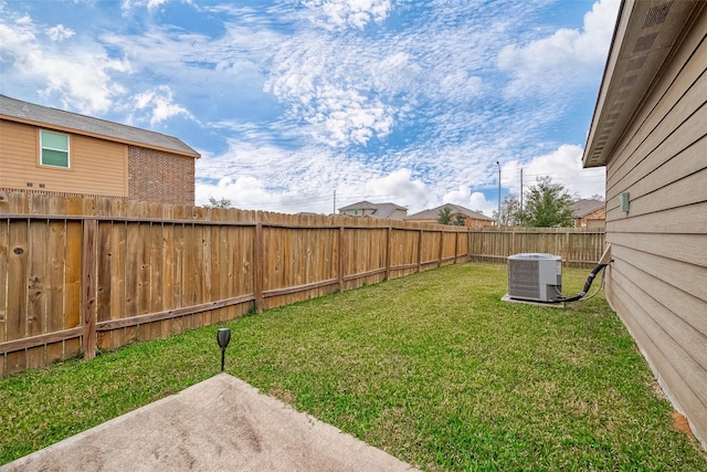 view of yard with a patio and central AC unit