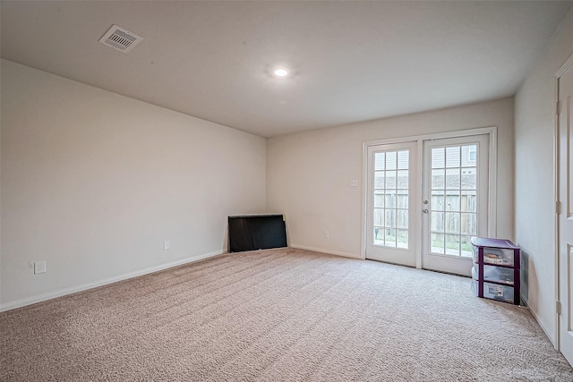 unfurnished living room with carpet