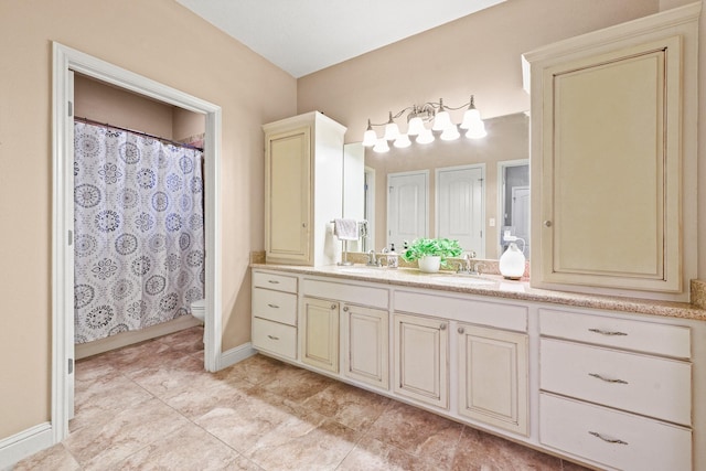 bathroom featuring tile patterned floors, vanity, toilet, and a shower with curtain